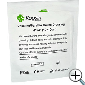 Non-adherent Vaseline-Paraffin blend drenched into fine mesh gauze